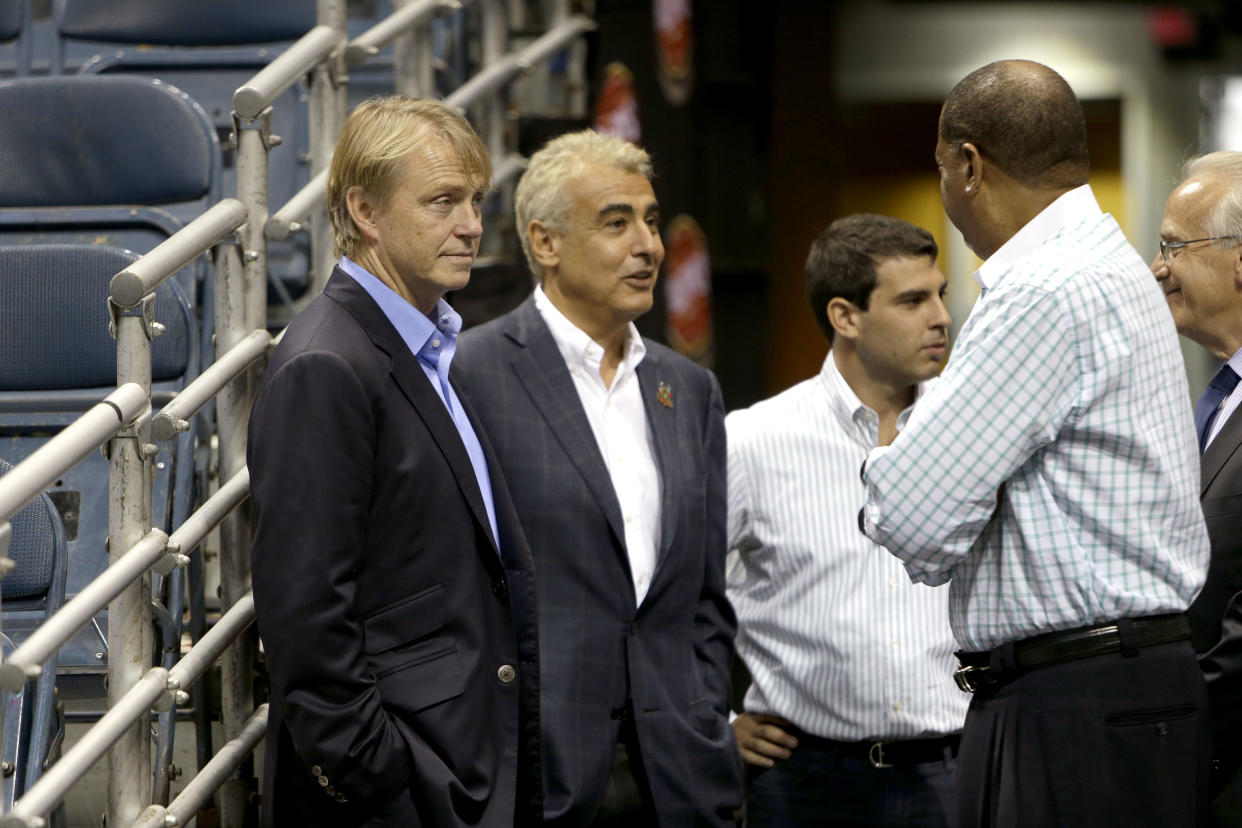MILWAUKEE, WI - JULY 2: (L-R) Owners Wesley Edens (L) & Marc Lasry (2L) await for the official announcement of their new head coach Jason Kidd to the Milwaukee Bucks at BMO Harris Bradley Center on July 2, 2014 in Milwaukee, Wisconsin. NOTE TO USER: User expressly acknowledges and agrees that, by downloading and or using this photograph, User is consenting to the terms and conditions of the Getty Images License Agreement. (Photo by Mike McGinnis/Getty Images)