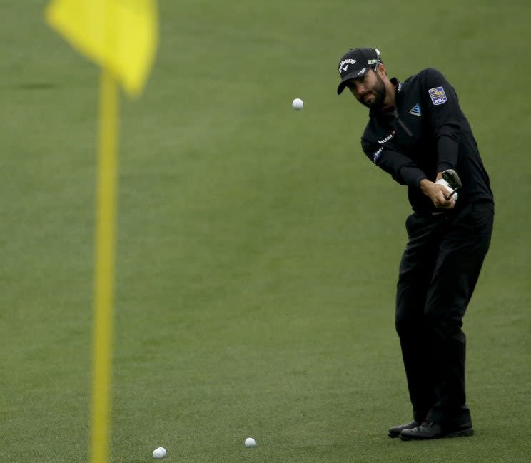 Adam Hadwin chips to the green on the second hole during a practice round for the Masters golf tournament Monday, April 3, 2017, in Augusta, Ga. (AP Photo/Charlie Riedel)