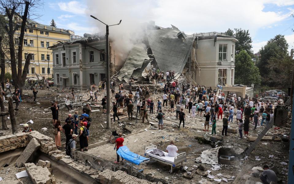 Rescuers work at Ohmatdyt Children's Hospital that was damaged during a Russian missile strike