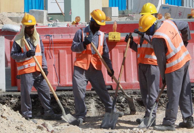 Workers at a World Cup construction site in Doha, on November 16, 2014