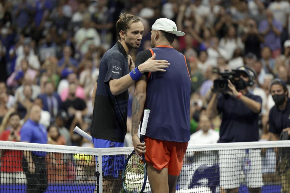 Daniil Medvedev, left, of Russia, and Nick Kyrgios, right, of Australia, greet each other after Kyrgios won the match during the fourth round of the U.S. Open tennis championships, Sunday, Sept. 4, 2022, in New York. (AP Photo/Adam Hunger)