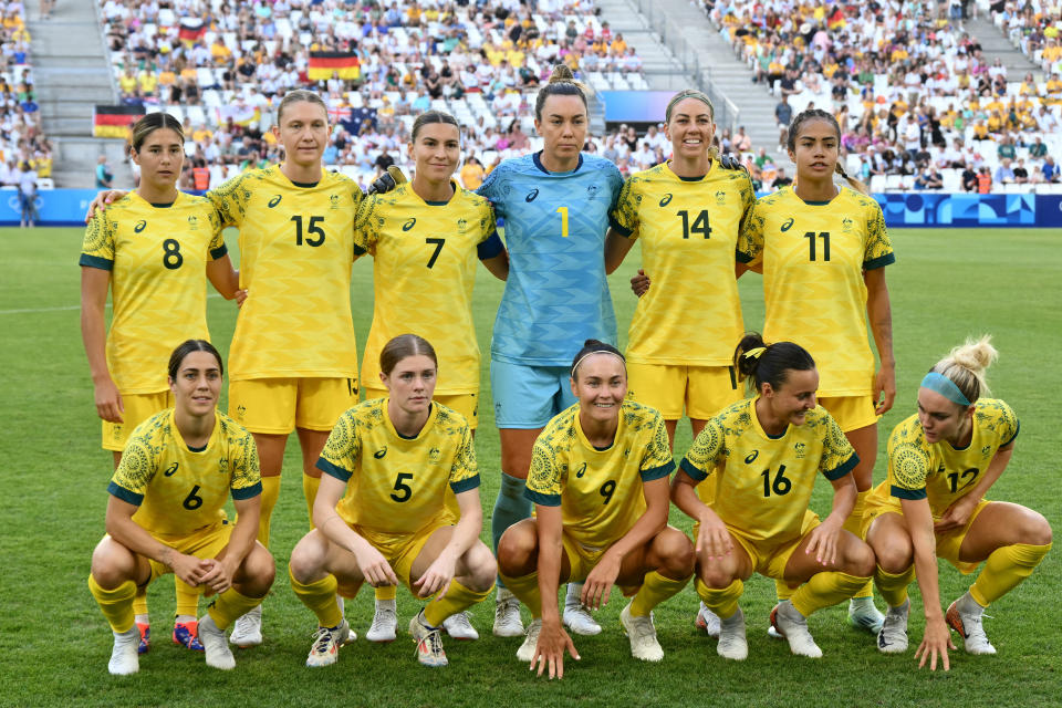 (Top from L) Australia's midfielder #08 Kyra Cooney-Cross, Australia's defender #15 Clare Hunt, Australia's defender #07 Steph Catley, Australia's goalkeeper #01 Mackenzie Arnold, Australia's defender #14 Alanna Kennedy, Australia's forward #11 Mary Fowler, (bottom from L) Australia's midfielder #06 Katrina Gorry, Australia's forward #05 Cortnee Vine, Australia's forward #09 Caitlin Foord, Australia's forward #16 Hayley Raso and Australia's defender #12 Ellie Carpenter pose for a team picture ahead of the women's group B football match between Germany and Australia during the Paris 2024 Olympic Games at the Marseille Stadium in Marseille on July 25, 2024. (Photo by Christophe SIMON / AFP) (Photo by CHRISTOPHE SIMON/AFP via Getty Images)