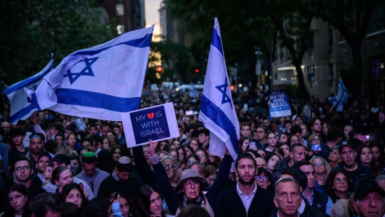 <div>People attend a "Stand with Israel" vigil and rally in New York City on October 10, 2023, after the Palestinian militant group Hamas launched an attack on Israel. Israel said it recaptured Gaza border areas from Hamas on October 10, 2023, the fourth day of fierce fighting that has left thousands dead on both sides since the militants launched a surprise attack. (Photo by Ed JONES / AFP) (Photo by ED JONES/AFP via Getty Images)</div>