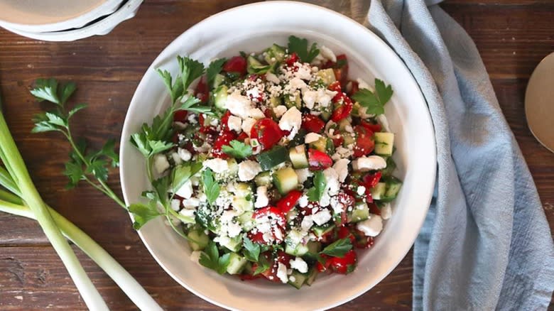 Shepherd salad in white bowl