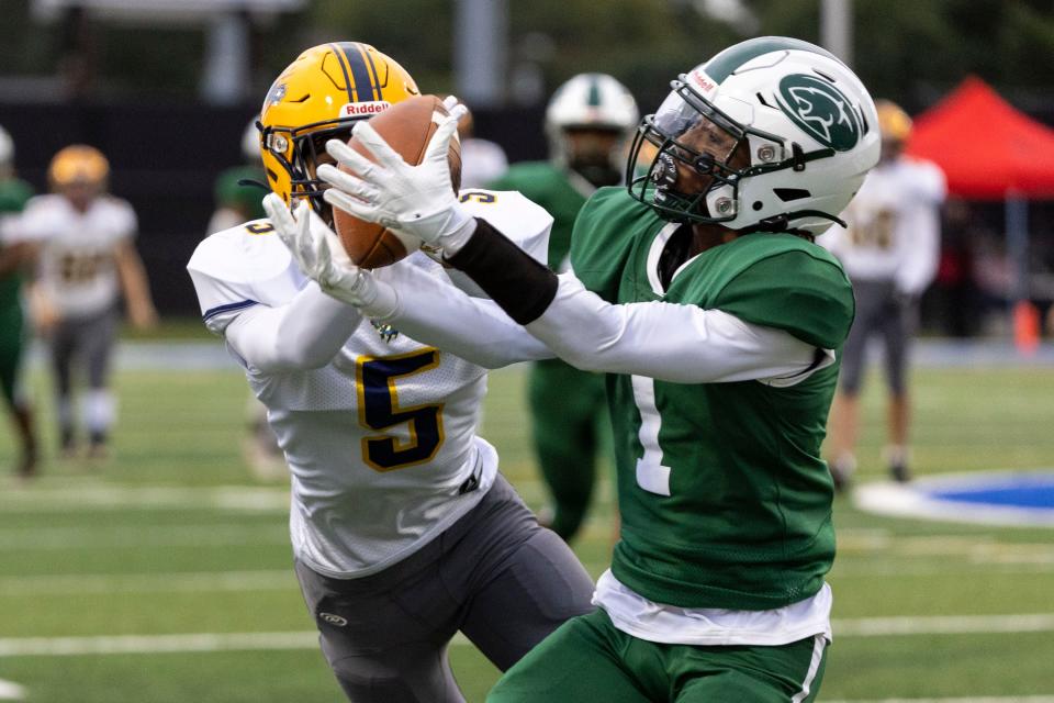 South Bend Washington's Devin Devries (1) breaks up pass intended for South Bend Riley’s Caleb Francis (5) during the South Bend Riley-South Bend Washington high school football game on Friday, September 23, 2022, at TCU School Field in South Bend, Indiana.