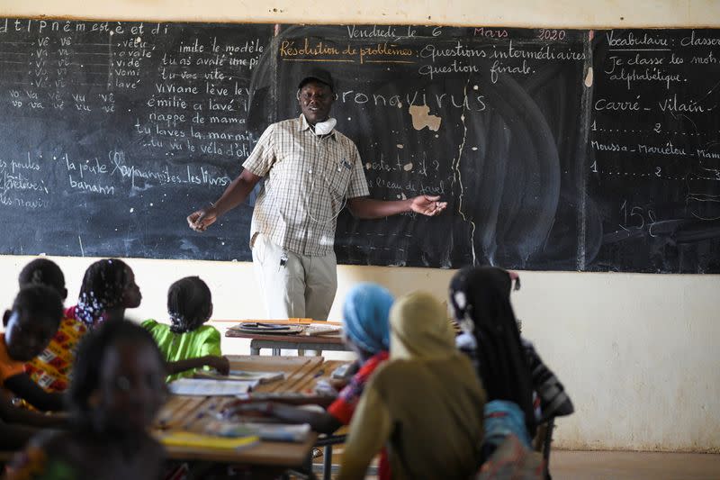 Abacar Sy, director of an elementary school, gives an awareness course about coronavirus at his classroom in Haliouri village, near Matam