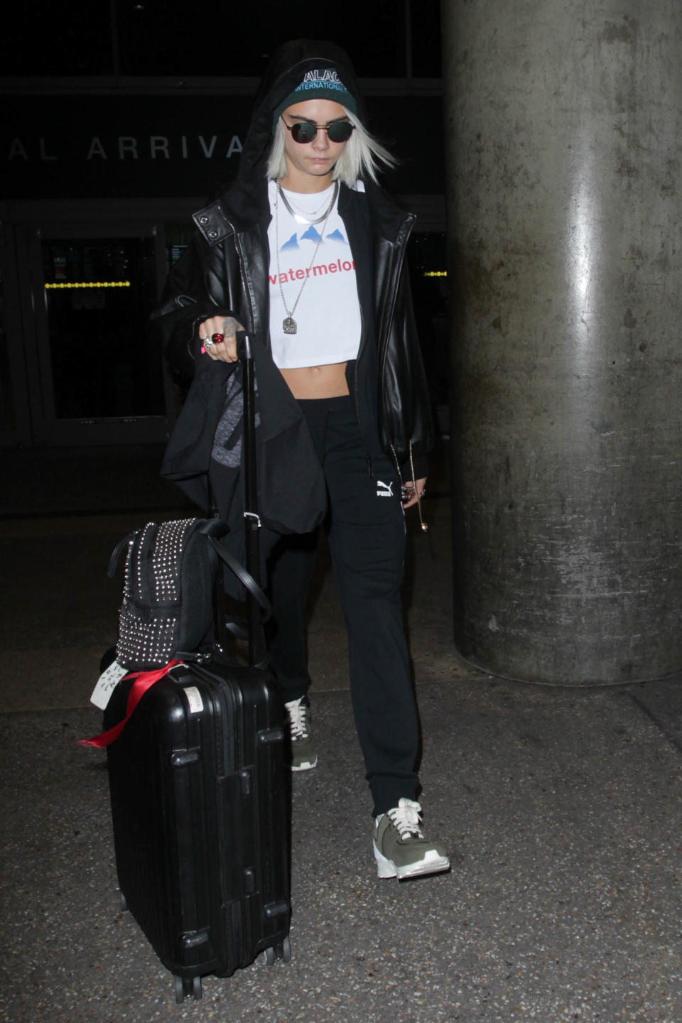 <p><strong>13 March</strong> Cara Delevingne kept it casual at LAX airport wearing a slogan tee, Puma tracksuit and sunglasses.</p>