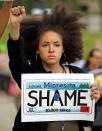 <p>A woman protests in support of Philando Castile during a rally on the capitol steps after a jury found St. Anthony Police Department officer Jeronimo Yanez not guilty of second-degree manslaughter in the death of Castile, in St. Paul, Minnesota, U.S. June 16, 2017. (Eric Miller/Reuters) </p>