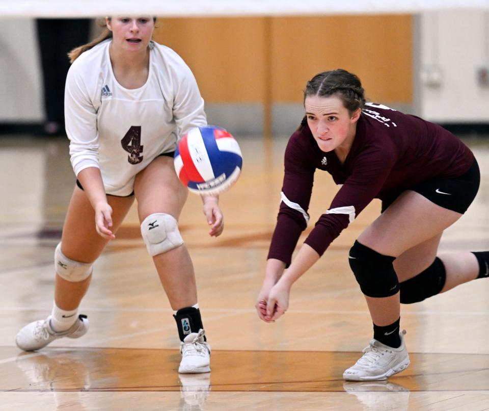 Anna Bennett of Falmouth goes for a Barnstable serve with her teammate Delia Roulston during an Sept. 19, 2022 match.