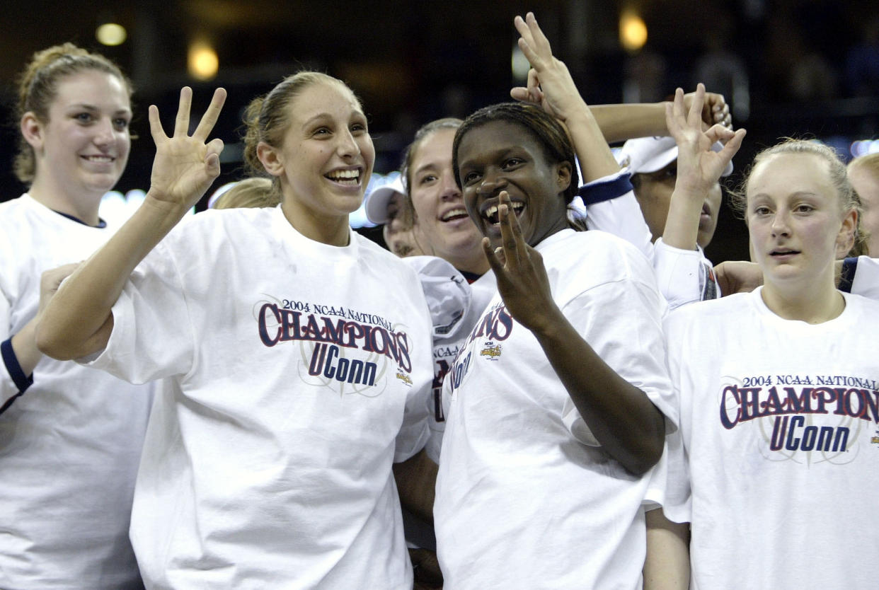 NEW ORLEANS - APRIL 6:  Diana Taurasi #3 of the University of Connecticut Huskies and teammate Barbara Turner #33 celebrate after defeating theTennessee Lady Vols 70-61 in the National Championship game of the NCAA Women's Final Four Tournament at the New Orleans Arena on April 6, 2004 in New Orleans, Louisiana.  (Photo by Elsa/Getty Images)