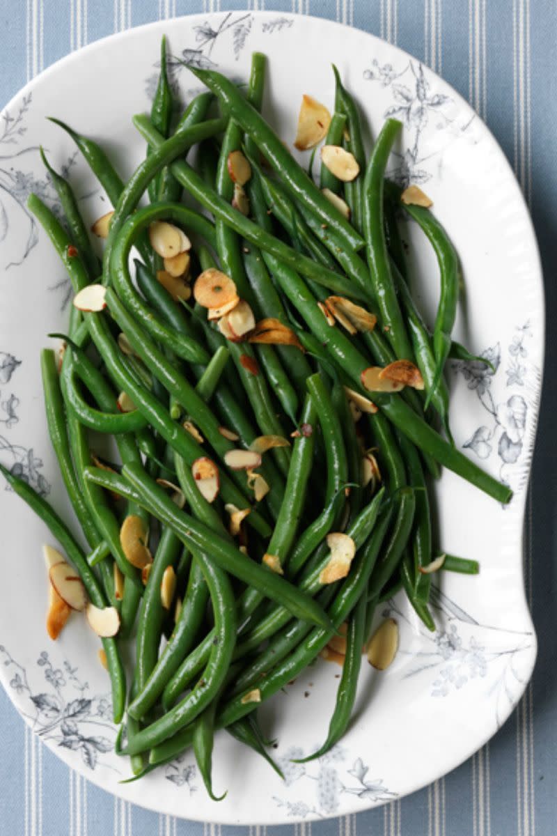 <p>Try adding almond-garlic oil to your green beans to amp up the flavor while keeping it healthy. </p><p>Get the <strong><a href="https://www.womansday.com/food-recipes/food-drinks/recipes/a11345/green-beans-toasted-garlic-almonds-recipe-124683/" rel="nofollow noopener" target="_blank" data-ylk="slk:Green Beans with Toasted Garlic and Almonds recipe;elm:context_link;itc:0;sec:content-canvas" class="link ">Green Beans with Toasted Garlic and Almonds recipe</a></strong>.</p>