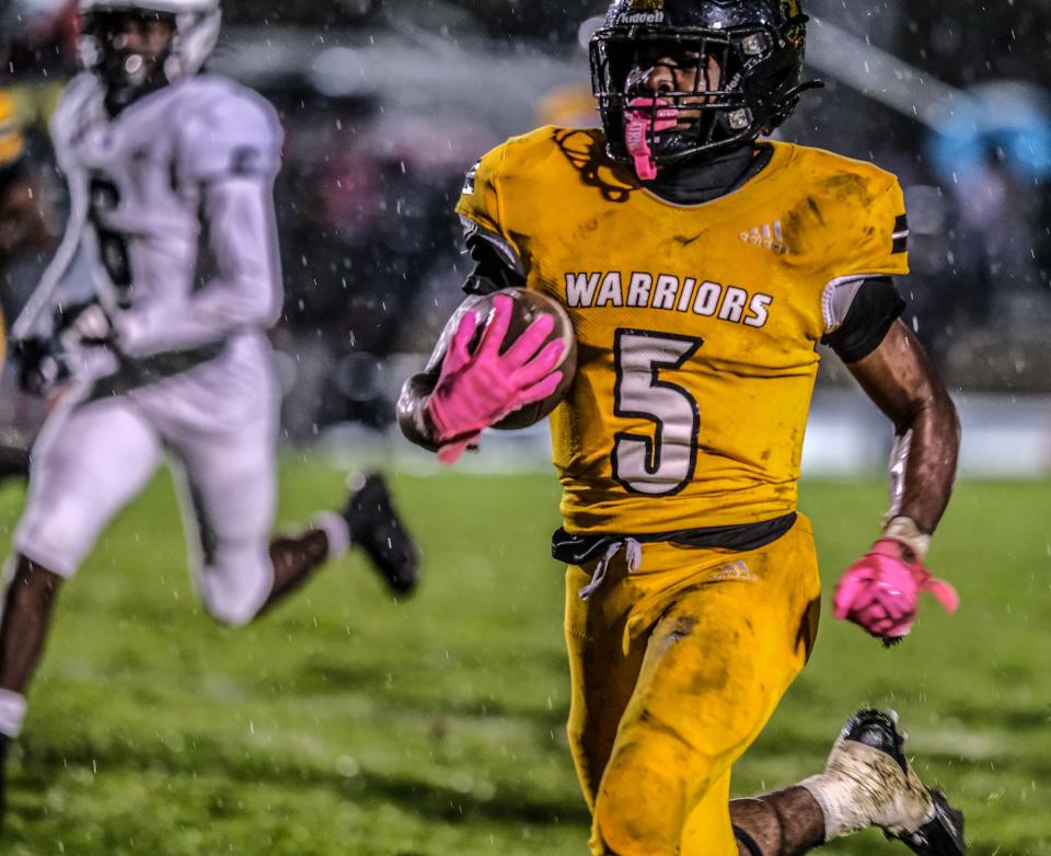 Waverly wide receiver Jahi Wood (5) runs in for Waverly's only touchdown of the game against East Lansing Friday, Oct. 6, 2023. East Lansing won 22-8.