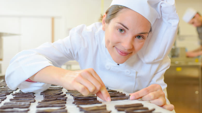 Making chocolate pretzel sticks 