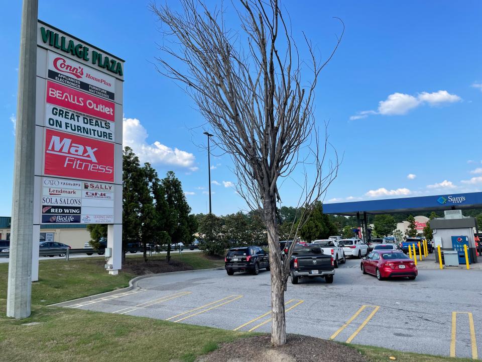 Cars queue at the Sam's Club fuel station at the Village Plaza shopping center on Bobby Jones Expressway in Augusta on June 1, 2022. The shopping center has been sold to an undisclosed buyer for $20.5 million.
