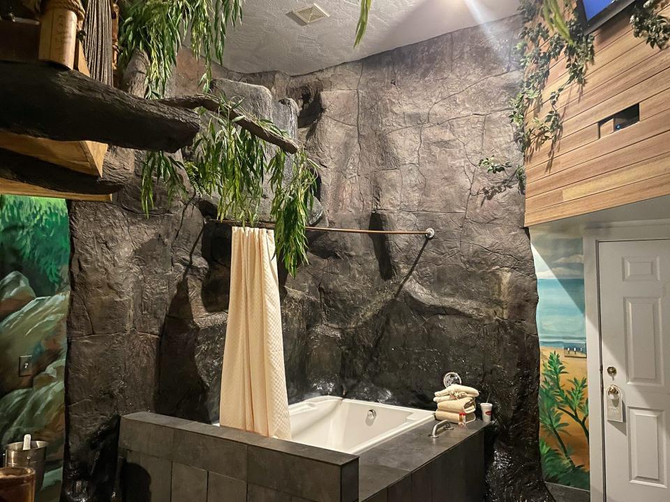 The waterfall tub is next to the suite's front door.