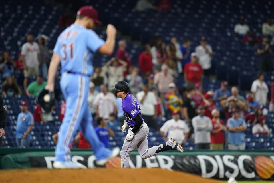 Colorado Rockies' Ryan McMahon, right, rounds the bases after hitting a two-run home run against Philadelphia Phillies pitcher Ian Kennedy during the ninth inning of a baseball game, Thursday, Sept. 9, 2021, in Philadelphia. (AP Photo/Matt Slocum)