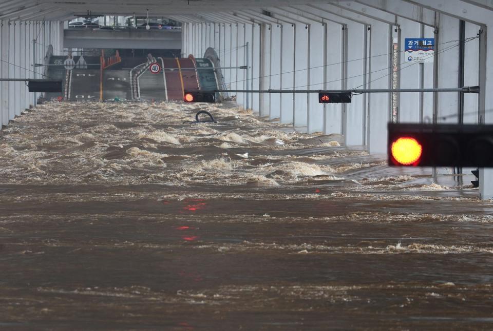 A bridge is flooded in Seoul on 9 August, 2022 (REUTERS)