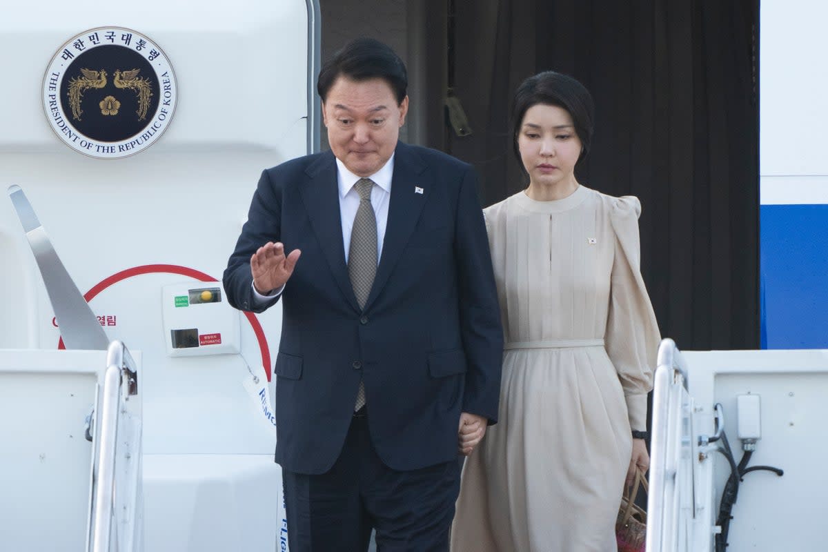 South Korea’s president Yoon Suk Yeol accompanied by first lady Kim Keon Hee (AP)