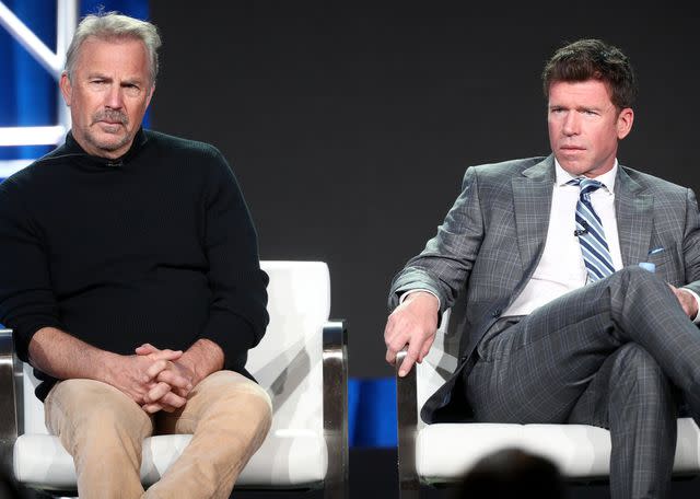 <p>Frederick M. Brown/Getty</p> (L-R) Kevin Costner and Taylor Sheridan of 'Yellowstone' speak onstage during the Paramount Network portion of the 2018 Winter Television Critics Association Press Tour on January 15, 2018 in Pasadena, California.