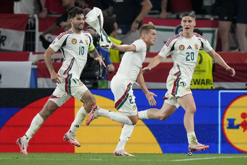 Hungary's Kevin Csoboth, center, celebrates after scoring an ultra late goal during a Group A match between Scotland and Hungary