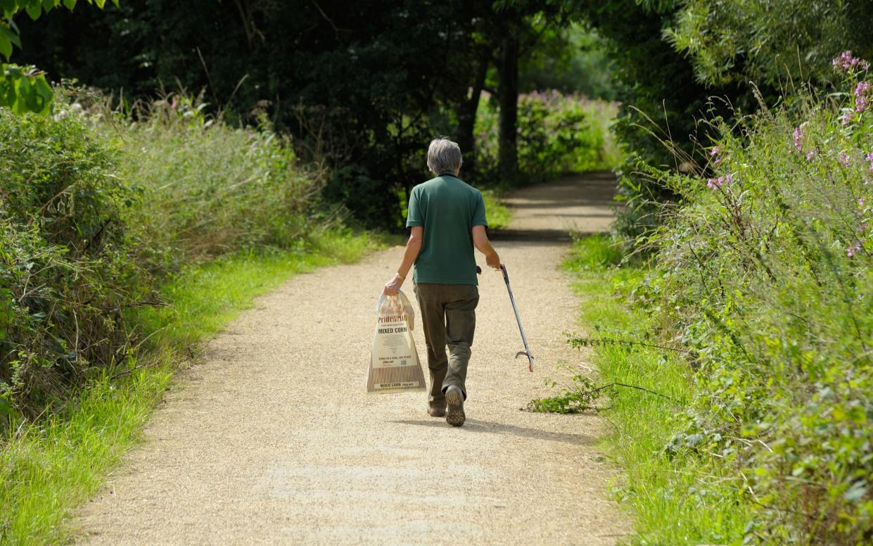 A worker collecting litter