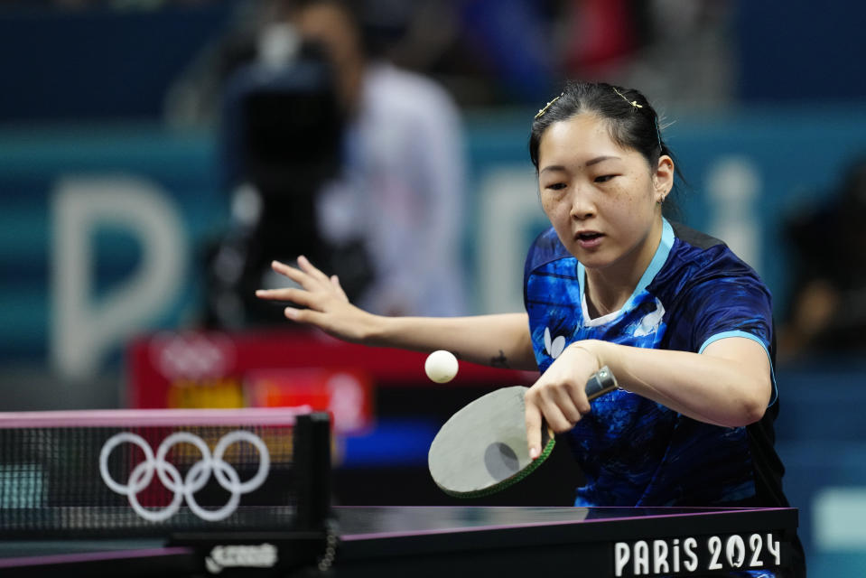 Taiwan's Chien Tung-Chuan plays against China's Wang Manyu during a women's teams quarterfinal table tennis match at the 2024 Summer Olympics, Wednesday, Aug. 7, 2024, in Paris, France. (AP Photo/Petros Giannakouris)