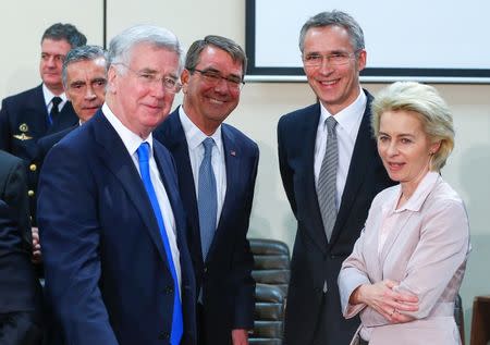 (L-R) Britain's Secretary of State for Defence Michael Fallon, U.S. Secretary of Defense Ash Carter, NATO Secretary General Jens Stoltenberg and German Defense Minister Ursula von der Leyen attend a NATO defense ministers meeting at the Alliance's headquarters in Brussels February 10, 2016. REUTERS/Yves Herman