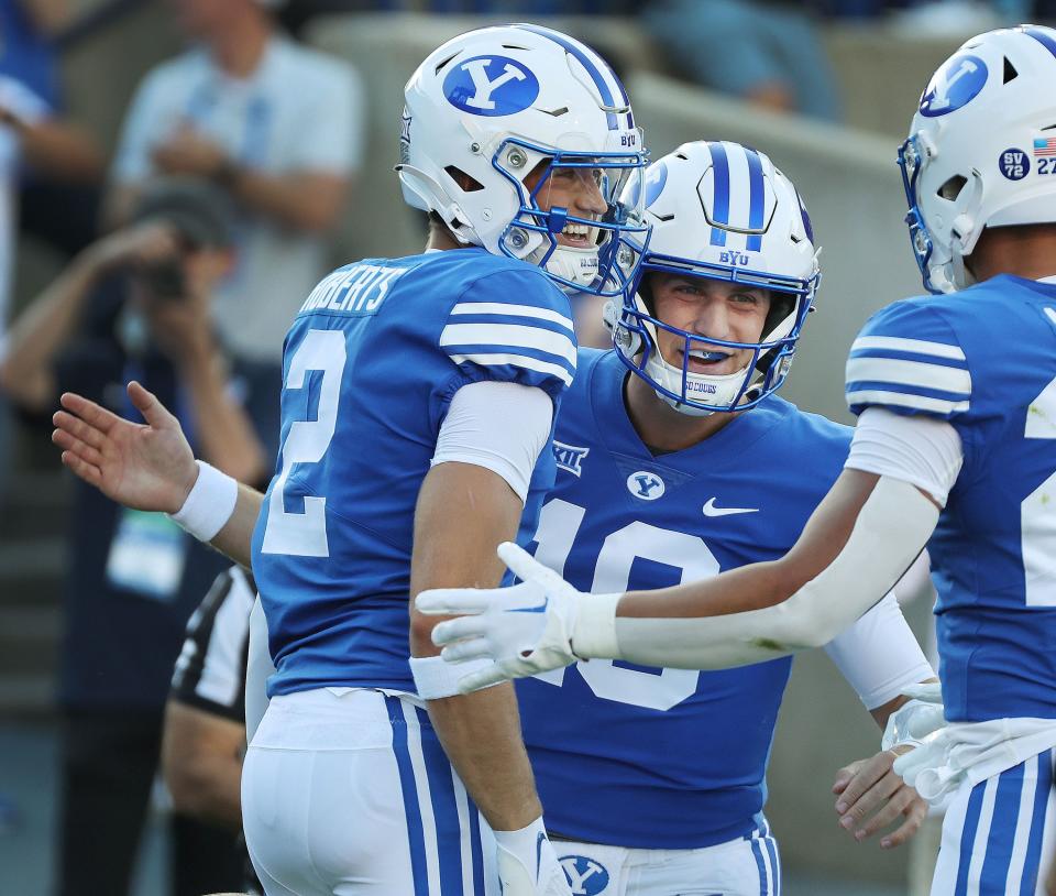 Brigham Young Cougars wide receiver Chase Roberts (2) celebrates his touchdown with quarterback Kedon Slovis (10) against the Texas Tech Red Raiders in Provo on Saturday, Oct. 21, 2023. BYU won 27-14.