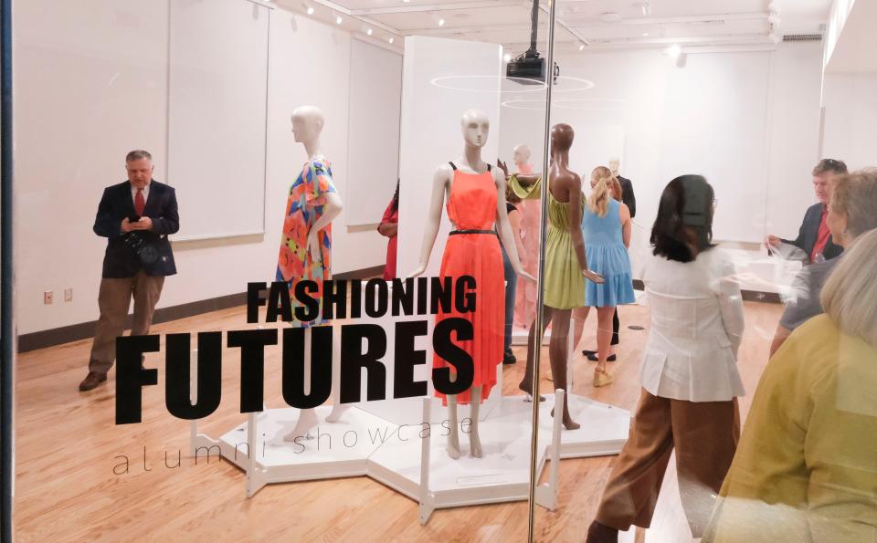 Tours move through the Jo Ann Boozer Ray Exhibition Gallery for the fashion design program during the dedication of Drummond Lyon Hall at the University of Alabama Friday, Sept. 8, 2023. Drummond Lyon Hall benefited from the Rising Tide capital campaign.