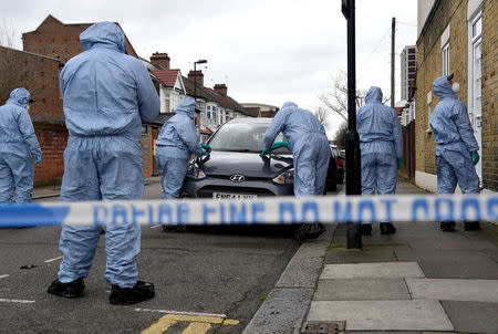 Forensic investigators examine a car on Chalgrove Road, where a teenage girl was murdered, in Tottenham, Britain, April 3, 2018. REUTERS/Toby Melville