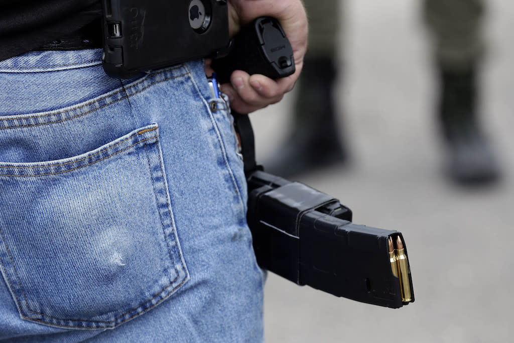 Bullets in a gun magazine holder.