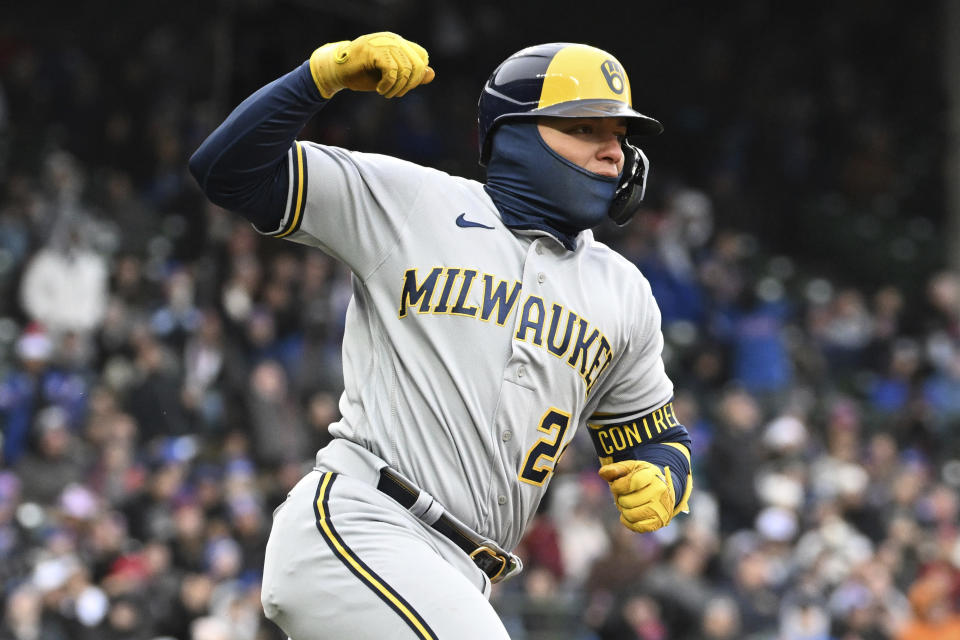 Milwaukee Brewers' William Contreras (24) reacts after hitting an RBI single during the eighth inning of a baseball game against the Chicago Cubs, Saturday, April 1, 2023, in Chicago. (AP Photo/Quinn Harris)