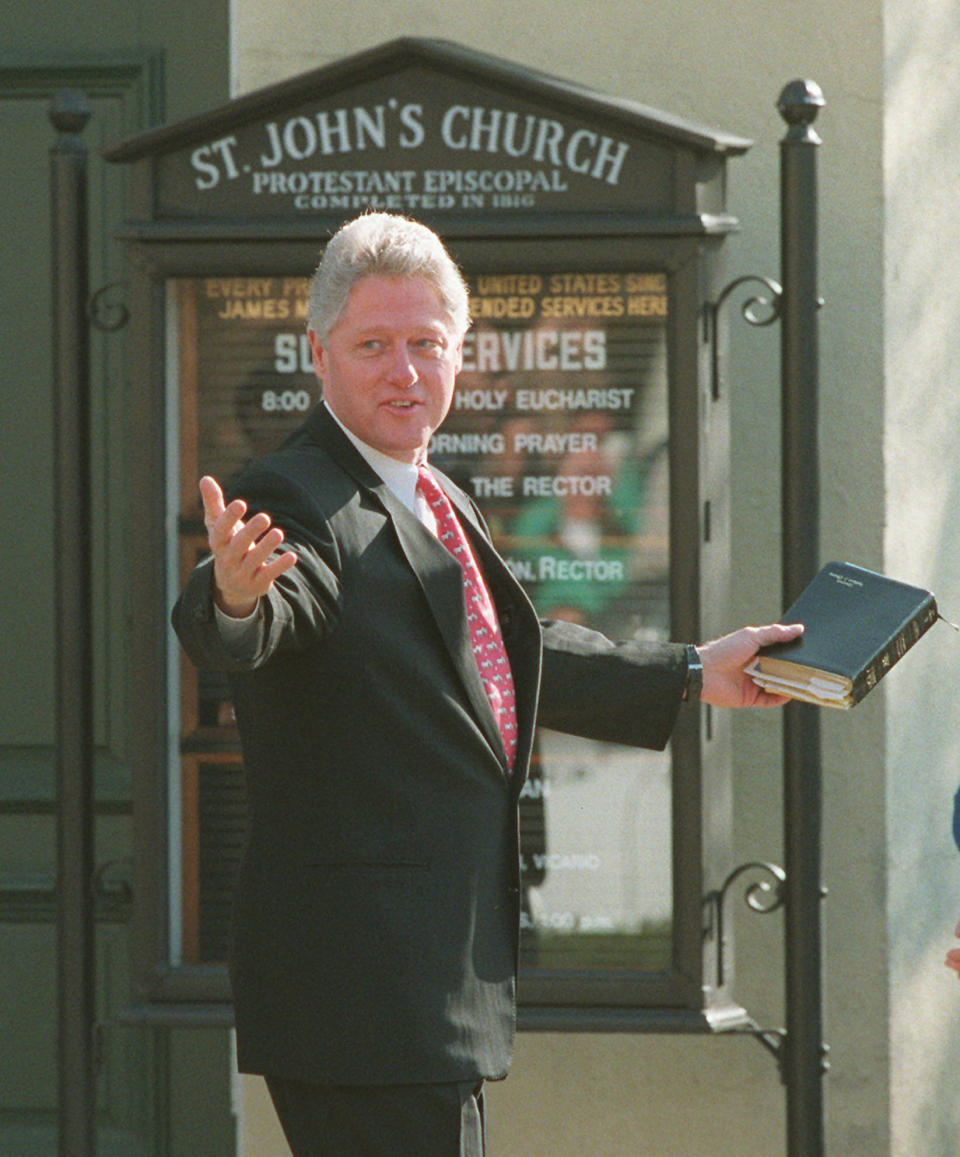 FILE - In this Sunday, March 24, 1996 file photo, President Bill Clinton leaves St. John's Church after attending services in Washington. Clinton attended without first lady Hillary Rodham Clinton, who opened an eight-day goodwill tour through Europe Sunday. (AP Photo/Ron Edmonds)