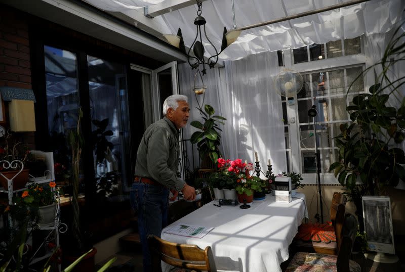 The Wider Image: Japan's tsunami survivors call lost loves on the phone of the wind