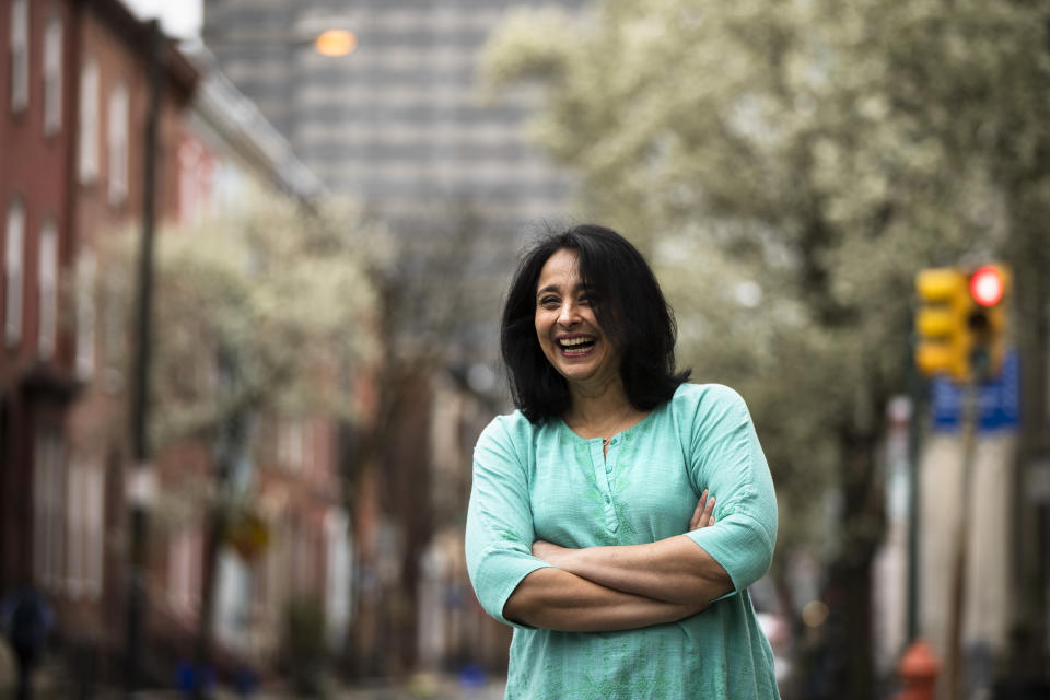 Suhag Shukla poses for a photograph in Philadelphia, Tuesday, March 31, 2020. Hindus around the world are in the midst of a 9-day celebration called Chaitra Navaratri that began with what for many is considered the Hindu New Year and will culminate with the festival of Ramanavami. Normally Shukla would be scrubbing her Philadelphia home more intensely than usual, a sign of the renewal the holiday signifies. There would be guests and Temple worship. But the temples are empty and the bells that worshippers ring are silent. (AP Photo/Matt Rourke)