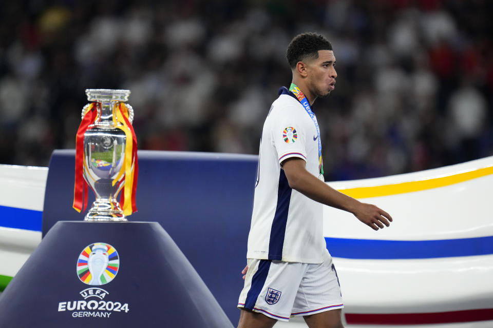 England's Jude Bellingham walks past the trophy after the final match between Spain and England at the Euro 2024 soccer tournament in Berlin, Germany, Sunday, July 14, 2024. Spain won 2-1. (AP Photo/Manu Fernandez)