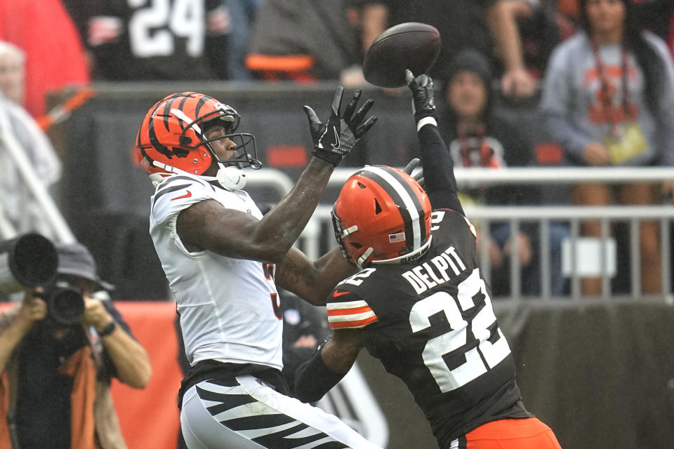 Cleveland Browns safety Grant Delpit (22) breaks up a pass intended for Cincinnati Bengals wide receiver Tee Higgins, left, during the second half of an NFL football game Sunday, Sept. 10, 2023, in Cleveland. (AP Photo/Sue Ogrocki)