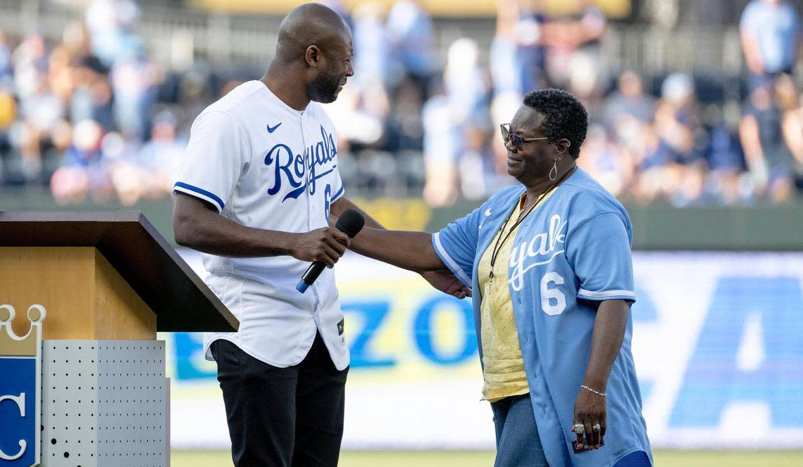 Patricia Cain comforts her son and former Kansas City Royals center fielder Lorenzo Cain during a retirement ceremony at Kauffman Stadium on Saturday, May 6, 2023, in Kansas City. Cain signed a ceremonial one-day contract to retire as a Royal.
