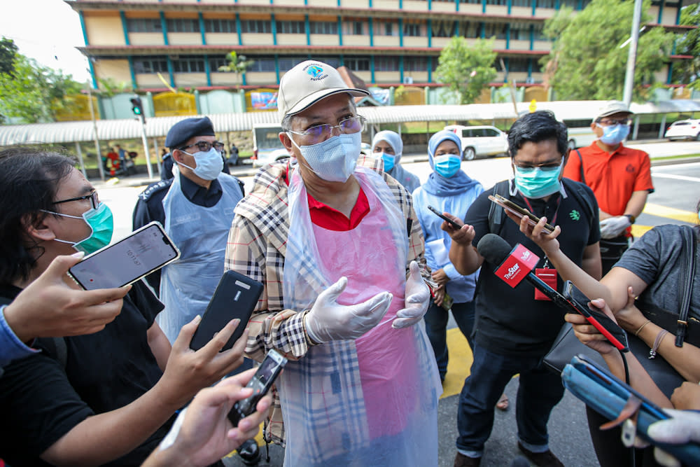 Federal Territories Minister Tan Sri Annuar Musa speaks to reporters after inspecting the sanitisation operations at the area around the Sri Petaling Mosque on March 28, 2020. ― Pictures by Hari Anggara