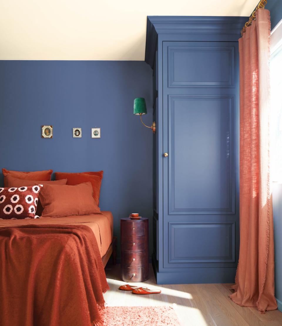 a bedroom with a blue door