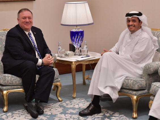 Sheikh Mohammed bin Abdulrahman al-Thani, Qatari deputy prime minister and minister of foreign affairs, (right) meets with US secretary of state Mike Pompeo (left) at the peace signing ceremony between the US and the Taliban in the Qatari capital Doha on 29 February 2020. (AFP via Getty Images)