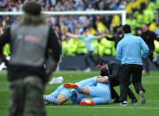 Manchester City's players and supporters celebrate on the pitch after their 3-2 victory over Queens Park Rangers in the English Premier League football match between Manchester City and Queens Park Rangers at The Etihad stadium in Manchester, north-west England on May 13, 2012. Manchester City won the game 3-2 to secure their first title since 1968. This is the first time that the Premier league title has been decided on goal-difference, Manchester City and Manchester United both finishing on 89 points. AFP PHOTO/PAUL ELLIS RESTRICTED TO EDITORIAL USE. No use with unauthorized audio, video, data, fixture lists, club/league logos or 'live' services. Online in-match use limited to 45 images, no video emulation. No use in betting, games or single club/league/player publications.PAUL ELLIS/AFP/GettyImages