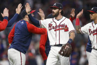 Atlanta Braves' Dansby Swanson celebrates with teammates after their 4-2 victory in a baseball game against the New York Mets, Saturday, Oct. 1, 2022, in Atlanta. (AP Photo/Brett Davis)