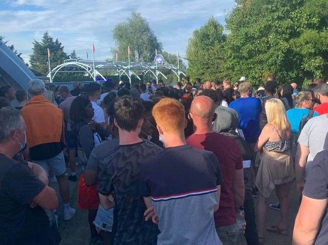 Undated handout photo taken with permission from the twitter feed of @abbiesear29 showing a crowd of people at Thorpe Park in Surrey after reports a police incident at the park on Saturday evening: PA