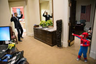 President Obama plays with the son of a staffer in the Outer Oval Office on Oct. 26. (Pete Souza/The White House)