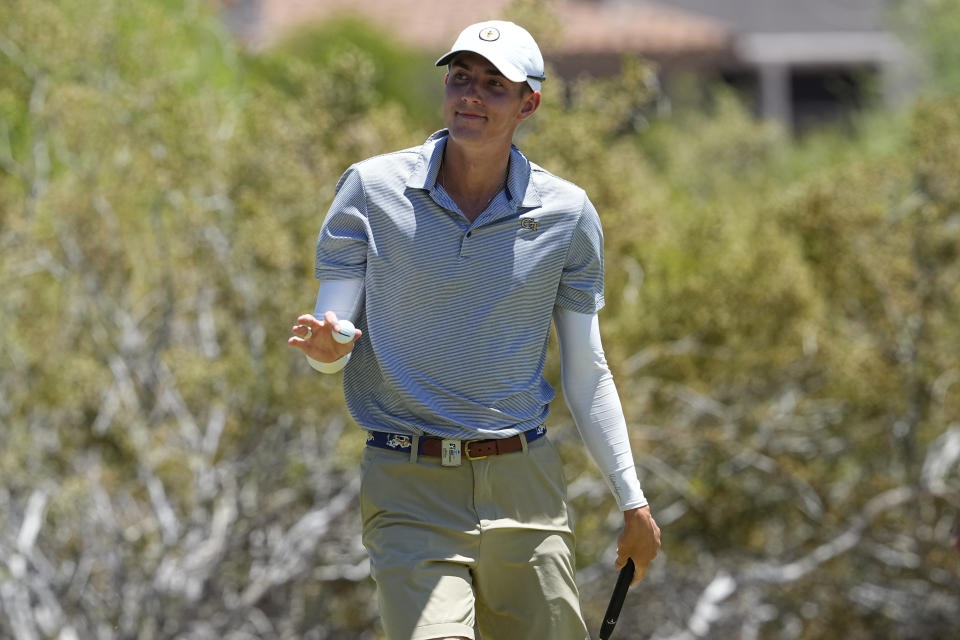 Georgia Tech golfer Ross Steelman waves after his shot on the third green during the final round of the NCAA college men's stroke play golf championship, Monday, May 29, 2023, in Scottsdale, Ariz. (AP Photo/Matt York)