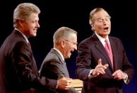 FILE PHOTO: Clinton, Perot and Bush laugh at the conclusion of their 1992 Presidential debate in East Lansing