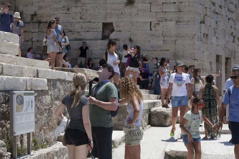 Tourists visit the Athens' Acropolis archaeological site in Athens, Greece where, as of Monday, the number of visitors will be capped after daily totals soared to 23,000. File photo by Dimitris Michalakis/UPI