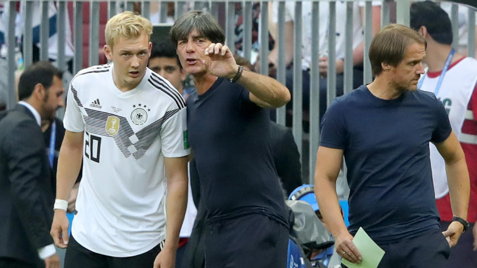 Low gives Brandt his instructions before coming on against Mexico. Pic: Getty