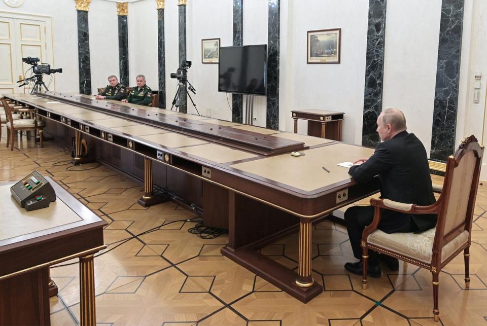 Putin meets with his defence minister Sergei Shoigu and his hief of the general staff Valery Gerasimov in Moscow on 27 February 2022, shortly after Russia invaded Ukraine (Sputnik/AFP/Getty)